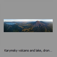 Karymsky volcano and lake, drone panorama